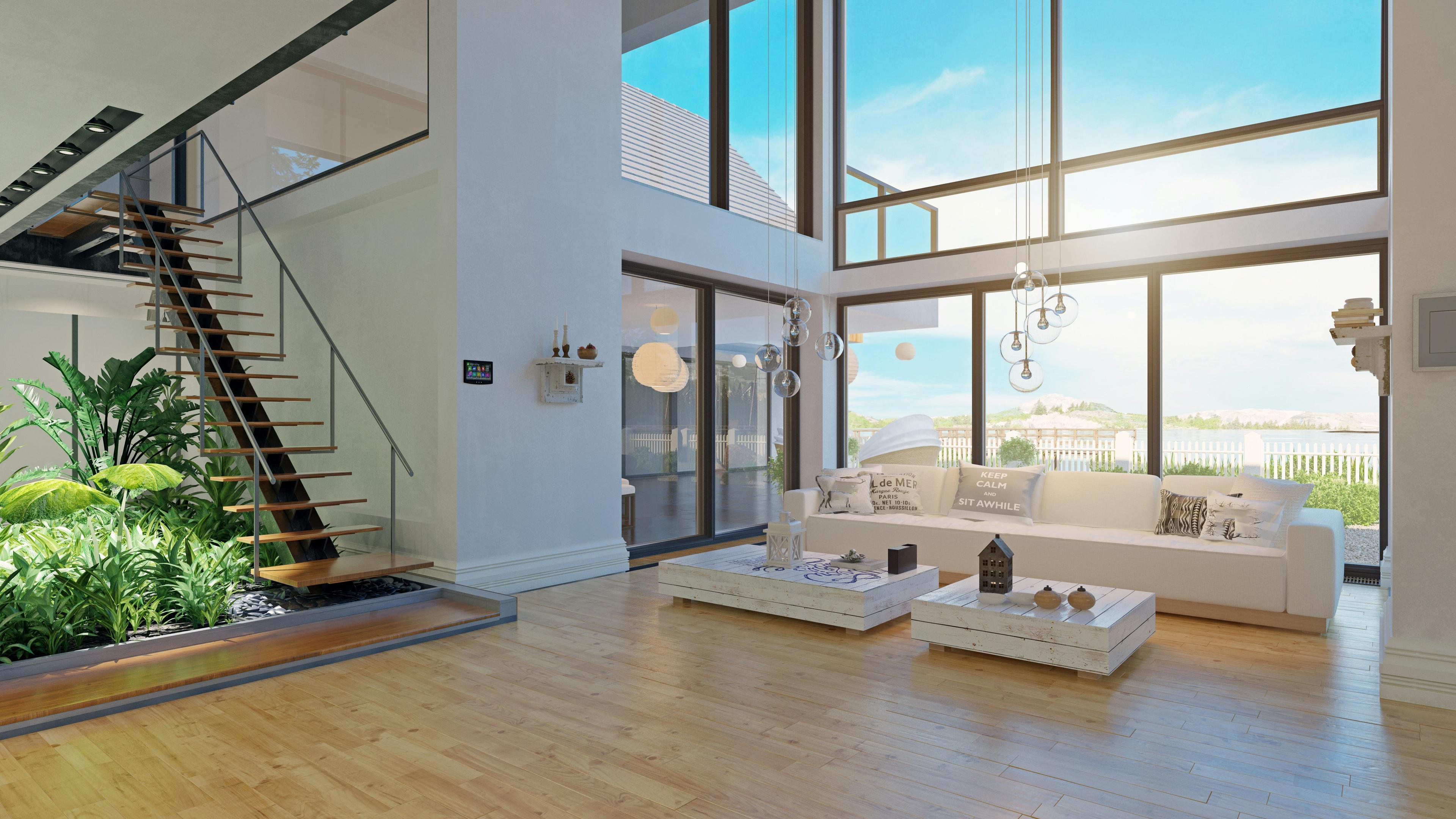 Bright open living space with floor-to-ceiling multi-pane windows